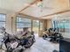 Spacious garage with a motorcycle, lawnmower, and natural light through multiple windows at 14034 Water Tower Dr, Hudson, FL 34667
