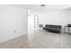 Spacious living room featuring tile flooring, neutral walls, and an open layout concept at 14034 Water Tower Dr, Hudson, FL 34667