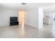 Bright living room featuring tile flooring, crisp white walls, and an open layout concept at 14034 Water Tower Dr, Hudson, FL 34667