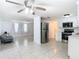 Open floor plan with tile flooring connecting the kitchen to the living area at 14034 Water Tower Dr, Hudson, FL 34667