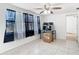 Sunroom featuring a ceiling fan and natural light from the windows at 14034 Water Tower Dr, Hudson, FL 34667