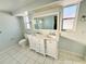 Double vanity bathroom with marble countertop at 1415 Weyford Ln, Holiday, FL 34691