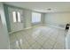 Bright and spacious living room with tile floors at 1415 Weyford Ln, Holiday, FL 34691