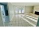 Living room features fireplace and access to patio at 1415 Weyford Ln, Holiday, FL 34691