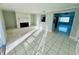 Spacious living room with fireplace and tile floors at 1415 Weyford Ln, Holiday, FL 34691