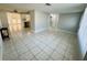 Open concept living area with views into the kitchen at 1415 Weyford Ln, Holiday, FL 34691