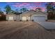 Newly constructed home with neutral siding and a two-car garage at 16434 Medley Rd, Weeki Wachee, FL 34614