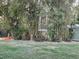 Landscaped backyard with bamboo and a wooden fence at 1761 Cupecoy Cir # N-1, Lutz, FL 33558
