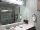 Modern bathroom with marble tile and a large mirror at 1761 Cupecoy Cir # N-1, Lutz, FL 33558