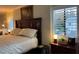 Spacious bedroom with a king-size bed and wood furniture at 1761 Cupecoy Cir # N-1, Lutz, FL 33558
