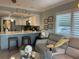Open concept kitchen and living area, featuring updated cabinetry and a breakfast bar at 1761 Cupecoy Cir # N-1, Lutz, FL 33558
