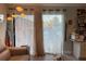 Bright living room with sliding glass doors leading to patio at 1761 Cupecoy Cir # N-1, Lutz, FL 33558