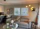 Living room with gray sectional sofa and floor lamp at 1761 Cupecoy Cir # N-1, Lutz, FL 33558