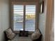Cozy window seat with pillows, overlooking the parking lot at 1761 Cupecoy Cir # N-1, Lutz, FL 33558