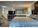 Main bedroom with a king-size bed and TV at 1761 Cupecoy Cir # N-1, Lutz, FL 33558