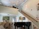 Bright living room with high ceilings, a piano, and a loft area at 1761 Cupecoy Cir # N-1, Lutz, FL 33558