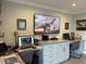 Spacious home office featuring two desks, ample storage and a large TV at 1761 Cupecoy Cir # N-1, Lutz, FL 33558