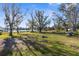 Large backyard with lake view and fire pit at 18104 Spencer Rd, Odessa, FL 33556