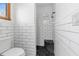 Modern bathroom with a walk-in shower and pebble floor at 18104 Spencer Rd, Odessa, FL 33556
