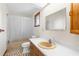 Clean bathroom with a tub, toilet and vanity at 18104 Spencer Rd, Odessa, FL 33556