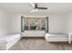 Bright bedroom with two twin beds and large window at 18104 Spencer Rd, Odessa, FL 33556