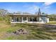 Ranch-style home with a large covered porch at 18104 Spencer Rd, Odessa, FL 33556