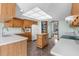 Kitchen with wood cabinets, an island, and a skylight at 18104 Spencer Rd, Odessa, FL 33556