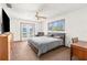 Main bedroom with a king-size bed and access to a patio at 18104 Spencer Rd, Odessa, FL 33556