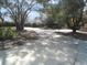 Circular driveway with mature trees at 18623 Firethorn Dr, Spring Hill, FL 34610