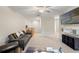 Bonus room with TV, couch, and plenty of space for relaxation at 194 Argyll Dr, Spring Hill, FL 34609