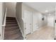 Hallway with carpeted stairs and tile flooring at 194 Argyll Dr, Spring Hill, FL 34609