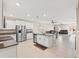 Open kitchen with island, stainless steel appliances, and granite countertops at 194 Argyll Dr, Spring Hill, FL 34609