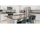 Island kitchen with granite countertops and stainless steel appliances at 194 Argyll Dr, Spring Hill, FL 34609