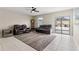 Relaxing living room with leather furniture and sliding glass doors at 194 Argyll Dr, Spring Hill, FL 34609