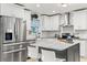 Modern kitchen with stainless steel appliances and a large island at 2015 Park N St, St Petersburg, FL 33710