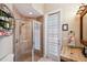 Bathroom with walk-in shower and granite sink at 20200 Lace Cascade Rd, Land O Lakes, FL 34637