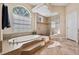 Bathroom with soaking tub and walk-in shower at 20200 Lace Cascade Rd, Land O Lakes, FL 34637