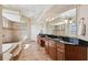 Large bathroom with double vanity and tub at 20200 Lace Cascade Rd, Land O Lakes, FL 34637