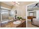 Bathroom with granite countertop, sink, and shower at 20200 Lace Cascade Rd, Land O Lakes, FL 34637