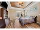 Primary bedroom with wood floors and built-in cabinetry at 20200 Lace Cascade Rd, Land O Lakes, FL 34637