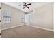 Carpeted bedroom with ceiling fan and window at 20200 Lace Cascade Rd, Land O Lakes, FL 34637