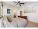 Serene bedroom with a neutral color scheme and large artwork at 20200 Lace Cascade Rd, Land O Lakes, FL 34637