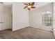 Bright bedroom with ceiling fan and carpet at 20200 Lace Cascade Rd, Land O Lakes, FL 34637