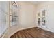 Well-lit bedroom with hardwood floors and French doors at 20200 Lace Cascade Rd, Land O Lakes, FL 34637
