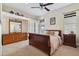 Cozy bedroom featuring a wooden sleigh bed and ample storage at 20200 Lace Cascade Rd, Land O Lakes, FL 34637