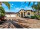 Grand home exterior with three-car garage and paver driveway at 20200 Lace Cascade Rd, Land O Lakes, FL 34637