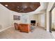 Spacious Gathering room with leather seating, a flat-screen TV, and sliding doors to the pool at 20200 Lace Cascade Rd, Land O Lakes, FL 34637