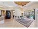 Gathering room with fireplace, access to pool, and high ceilings at 20200 Lace Cascade Rd, Land O Lakes, FL 34637
