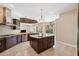 Bright kitchen boasts granite countertops, stainless steel appliances, and an island at 20200 Lace Cascade Rd, Land O Lakes, FL 34637
