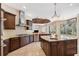 Gourmet kitchen with granite island, stainless steel appliances, and ample cabinetry at 20200 Lace Cascade Rd, Land O Lakes, FL 34637
